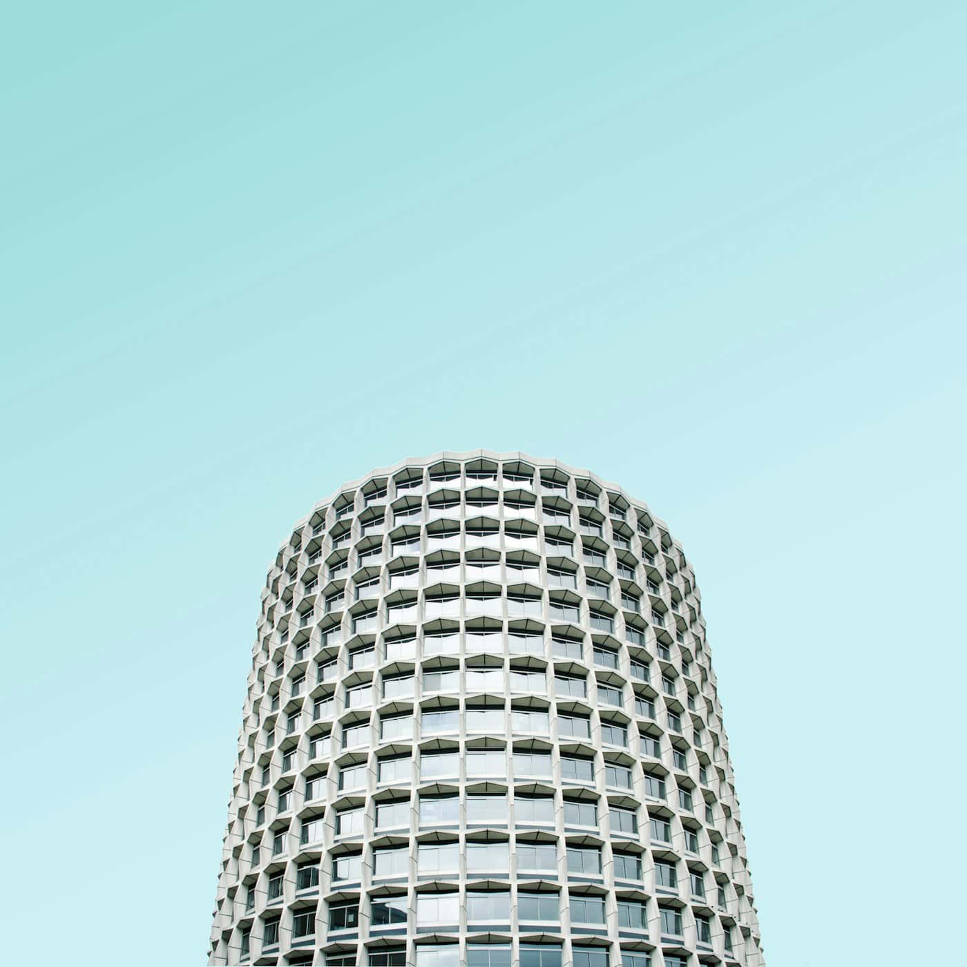 Exterior of a modern building under an expansive sky
